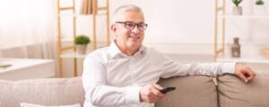 Man wearing glasses enjoying TV time